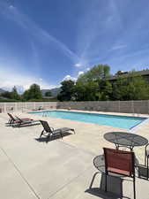 Community pool with a patio area