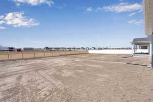 View of yard featuring fence