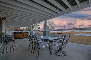 View of patio / terrace with outdoor dining area and a hot tub