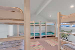 Bedroom featuring carpet floors, lofted ceiling with beams, and recessed lighting