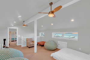 Bedroom with lofted ceiling, recessed lighting, a ceiling fan, and light colored carpet