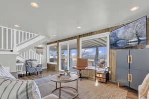 Living room with visible vents, baseboards, recessed lighting, and wood finished floors