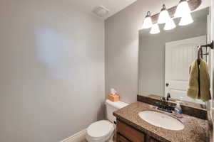 Half bath with toilet and vanity