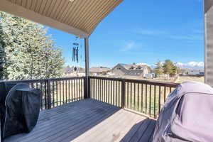 Deck featuring a residential view and area for grilling