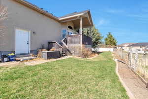 View of yard featuring fence