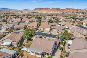 Aerial perspective of suburban area with a mountain backdrop