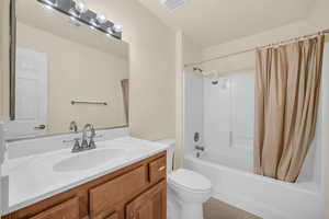 Full bathroom with vanity and shower / bathtub combination with curtain