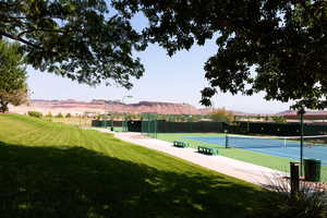 View of tennis court featuring a mountain view