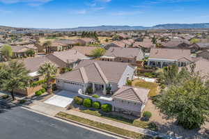 Aerial view of residential area with a mountainous background