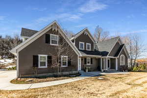 Traditional-style home with roof with shingles