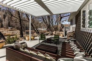 View of patio / terrace with a pergola and an outdoor living space