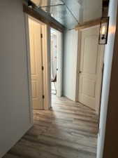Hallway featuring wood finished floors