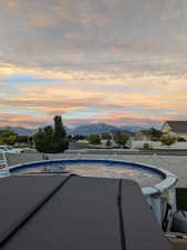 Pool at dusk with a mountain view