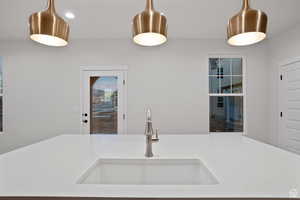 Kitchen featuring light countertops and a sink