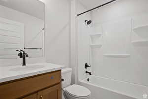 Full bathroom with  shower combination, toilet, and vanity