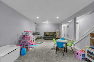 Game room with baseboards, visible vents, recessed lighting, and carpet