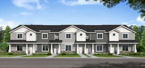 View of front of home with stone siding and board and batten siding