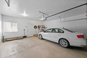 Garage featuring a garage door opener