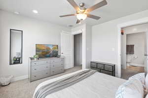 Bedroom with baseboards, visible vents, ceiling fan, and carpet floors