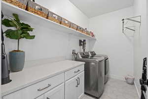 Main level laundry with extra storage/work space