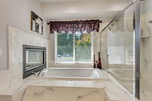 Owners En Suite Bathroom - Tub with Double Sided Fireplace