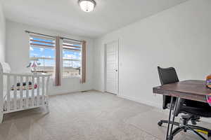 Carpeted bedroom with baseboards and visible vents