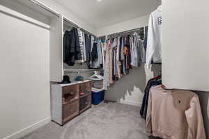 Walk in closet featuring carpet