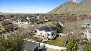 Birds eye view of property with a residential view and a mountain view