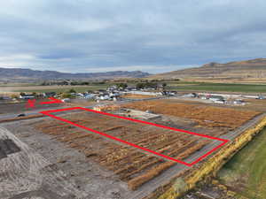Drone / aerial view featuring a mountain view and a rural view