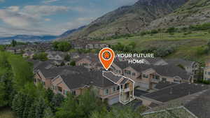View of property location with nearby suburban area and a mountainous background
