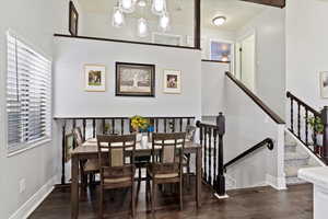 Dining area featuring baseboards and wood finished floors