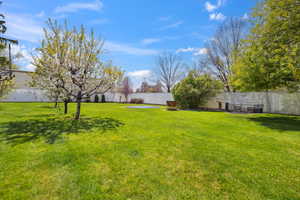 View of yard featuring fence