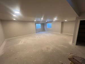 Basement featuring recessed lighting and baseboards