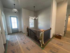 Entrance foyer featuring a notable chandelier