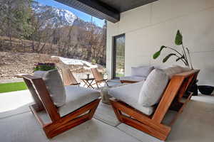 View of patio with an outdoor living space and a mountain view