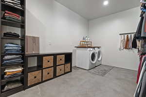 Laundry room with washer and dryer and laundry area
