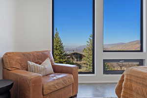 Living area with plenty of natural light and baseboards