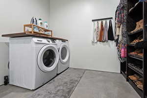 Laundry area featuring laundry area and separate washer and dryer