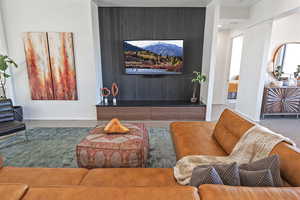 Living room with baseboards and visible vents