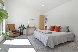 Bedroom featuring baseboards, high vaulted ceiling, and recessed lighting