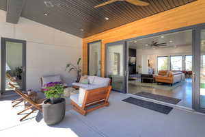 View of patio featuring an outdoor hangout area and ceiling fan