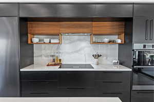 Kitchen featuring modern cabinets and open shelves