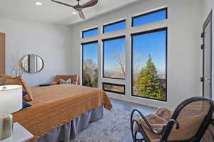 Bedroom featuring multiple windows, ceiling fan, baseboards, and recessed lighting