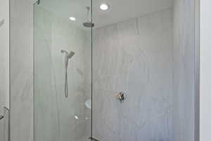 Full bathroom featuring a marble finish shower
