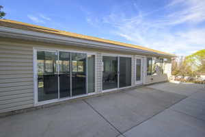 Back of property with a patio