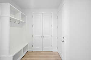 Mudroom featuring light wood-style flooring