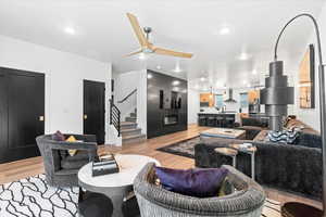 Living area featuring recessed lighting, stairway, and light wood-type flooring