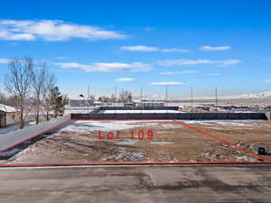 View of parking / parking lot with fence