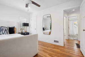 Bedroom with baseboards, recessed lighting, visible vents, and light wood-style floors