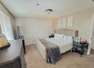 Master Bedroom with light colored carpet